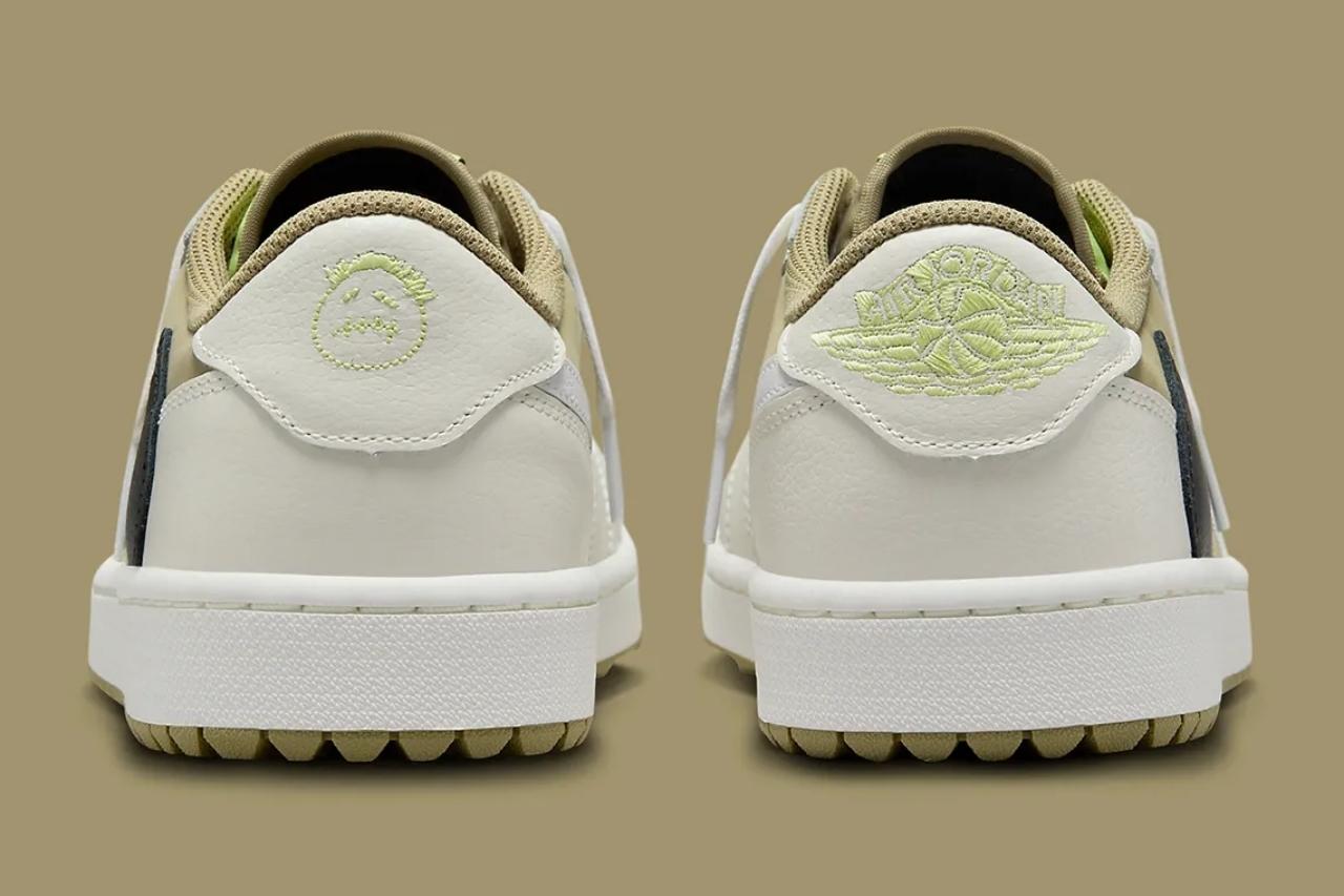 logo Swoosh ngược màu đen và các điểm nhấn màu xanh lá cây tươi sáng trên nhãn lưỡi và logo gót chân.